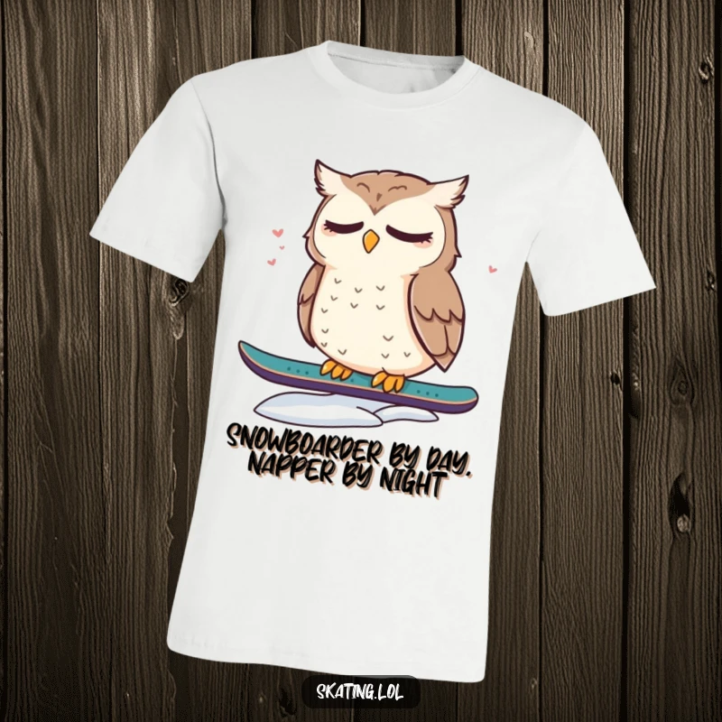 Funny t-shirt featuring a cute, dazed owl sitting on a snowboard, looking sleepy and adorable, ideal for winter enthusiasts.